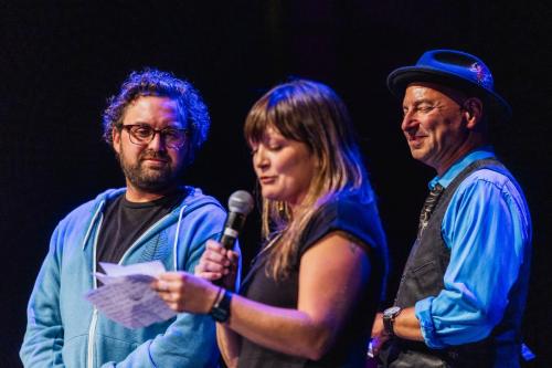 Ryder Sutton and Lauren Ciampa read the audience participation submissions while Marc Moss looks on.Donal Lakatua