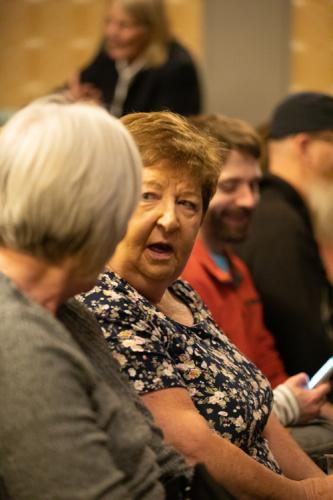 Audience members share stories of their own as they prepare to listen to "The Kindness of Strangers" stories.  kmr studios